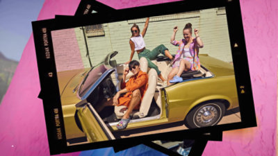 A group of people in a convertible car