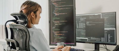 A woman working on a computer.