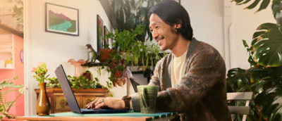  A person typing on a laptop.