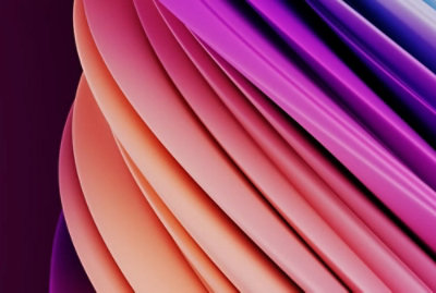 ピンクとオレンジの波状の表面のクローズアップ。