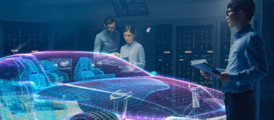 A group of people looking at a digital screen