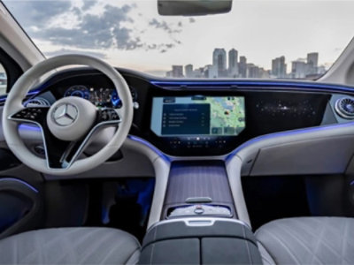 A steering wheel and dashboard of a car.