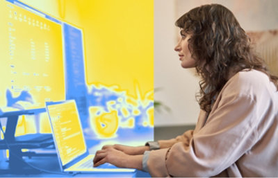 A person typing on a laptop.