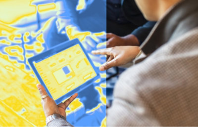 A close-up of a hand holding a tablet.