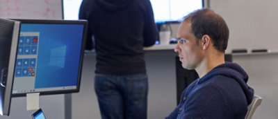 A person looking at a computer screen.