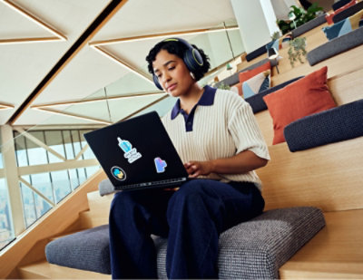 An woman using a computer.