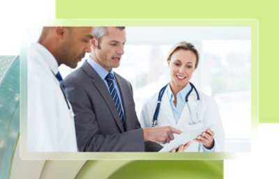 A group of doctors looking at a document.
