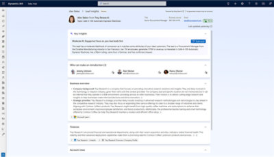 Screenshot of Dynamics 365 Sales Hub showing contact details for Alex Baker from Troy Research with insights, business overview, finances, and account news.