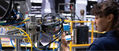 A woman holding a phone.