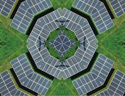 A kaleidoscope of solar panels on a green surface