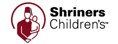 Shriners Children's 的徽标，图中是一位男士抱着一个孩子，白色背景上有黑色文字。