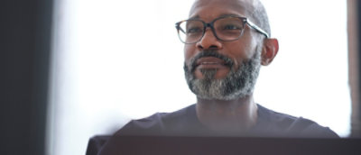 A man with glasses and a beard.