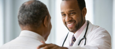 A close-up of a doctor smiling.