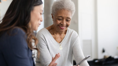 A woman talking to a doctor.