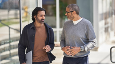 Two person discussing image