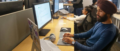 A group of people working on computers.