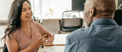 A man and woman sitting at a table.