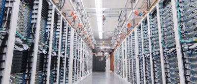 A woman writing something on the white board and smiling