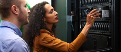 A man and woman checking device