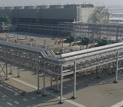 A large industrial building with pipes.