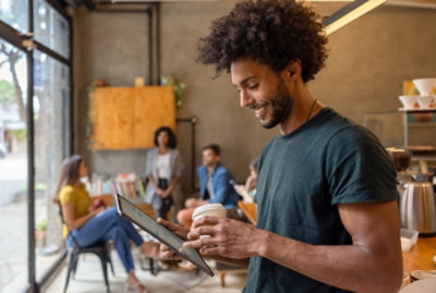 A person holding a tablet.