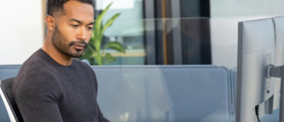 A man looking down at something.