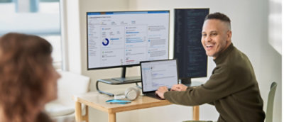 A man looking at another person and laughing