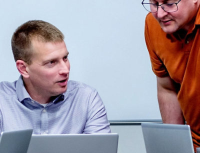 A group of people looking at laptops.