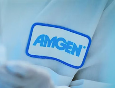 A close-up of the AMGEN® logo on a white surface.
