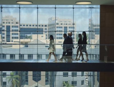 A group of people walking in a building.