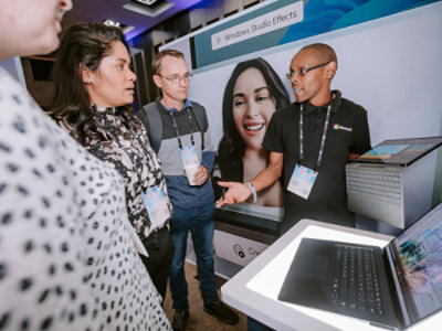 A computer monitor displaying Windows Studio Effects with a keyboard below.