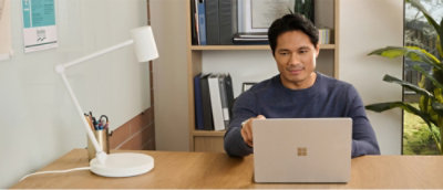 A man looking at the laotop.