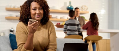 A woman holding a phone.