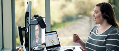A man sitting at a desk with a computer.