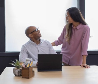 A modern beauty store interior featuring skincare products on display. The decor includes illuminated signage 