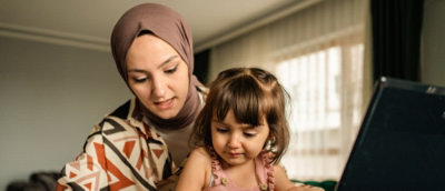  A Women and a girl using laptop