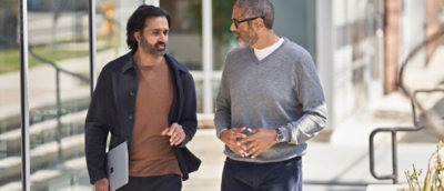 A group of men walking together outdoors.