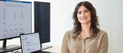 A woman with brown hair smiling.