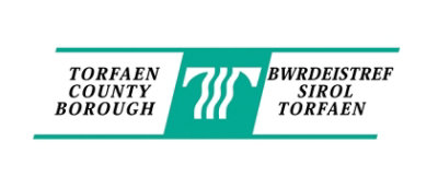A green and white rectangular sign with the text TORFAEN BWRDEISTREF COUNTY SIROL BOROUGH TORFAEN.