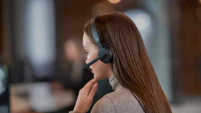 A woman wearing a headset.