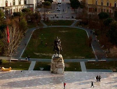 A statue of a man on a horse in a park.