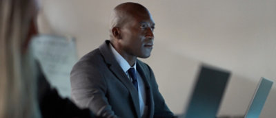 A person wearing a suit and tie.