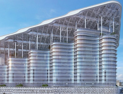 A large building with a roof under a clear blue sky.