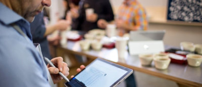 A person holding a tablet.