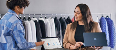 A woman looking at a laptop.