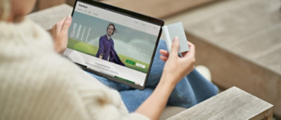 A person holding a tablet.