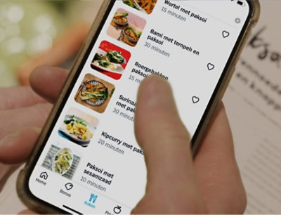 A close-up of a phone displaying a list of food items and preparation times.