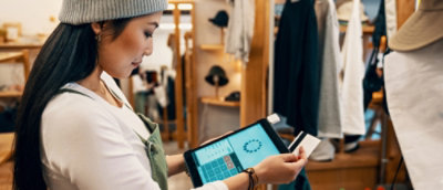 A person holding a tablet.