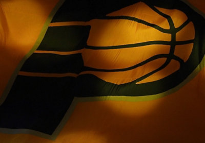 Close-up of the Pacers logo featuring a blue and gold color scheme with a stylized "P" and basketball design.