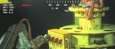 An industrial machine and digital overlay on the image.